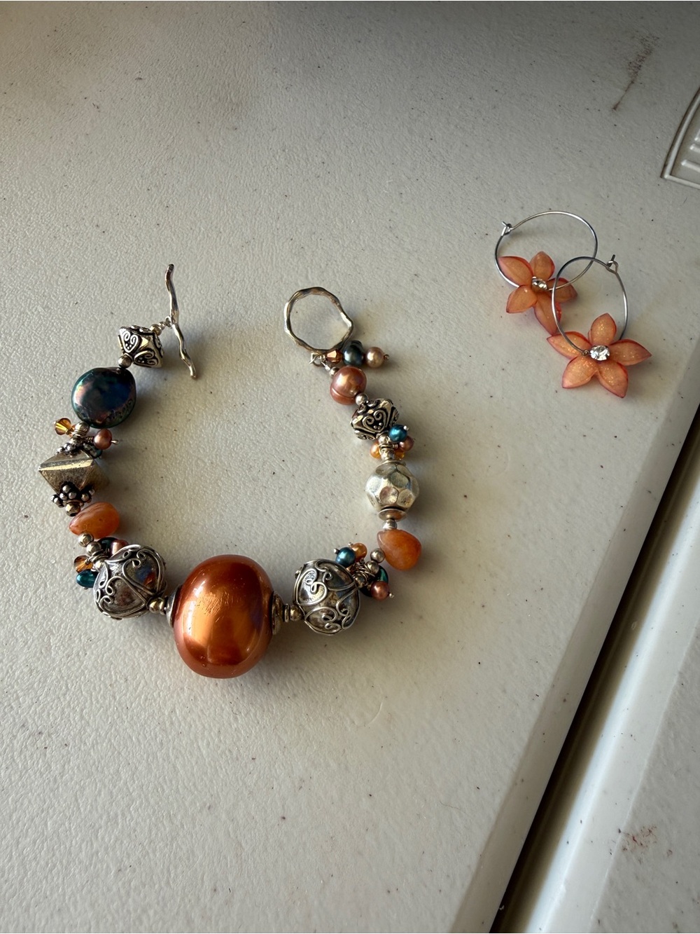 Handcrafted Orange Bead and Silver Accent Bracelet with flower earrings